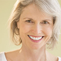 mature woman displays her tooth colored fillings
