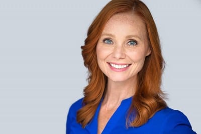 beautiful red head woman shows off her amazing smile