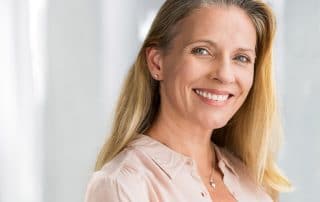 mature woman showing of her natural looking smile