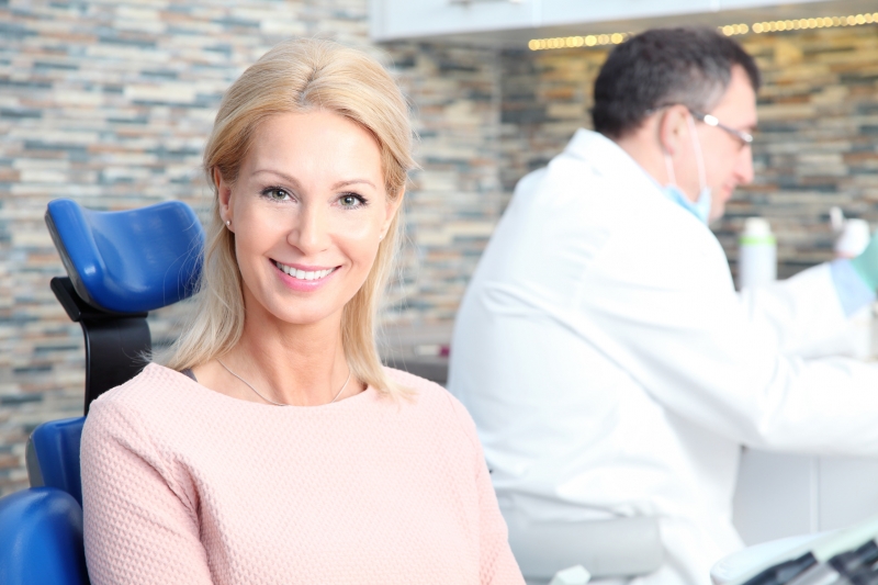 beautiful woman smiling in her dentists chair
